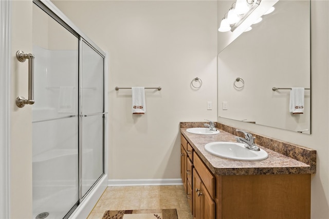 bathroom featuring walk in shower, tile patterned flooring, and vanity