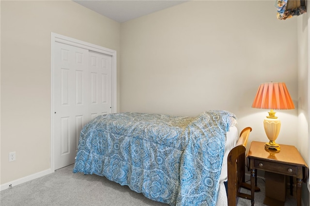 bedroom with a closet and carpet floors