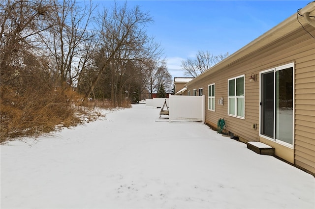 view of yard layered in snow