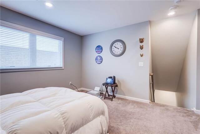 bedroom featuring light colored carpet