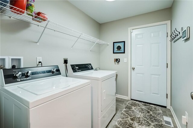 laundry room featuring independent washer and dryer