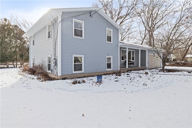 view of snow covered house