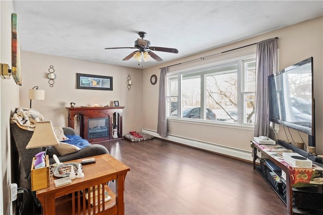 interior space with ceiling fan, baseboard heating, and dark hardwood / wood-style floors