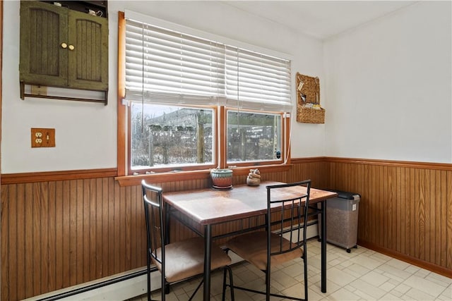 dining room with a baseboard radiator and plenty of natural light