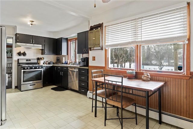 kitchen featuring sink, stainless steel appliances, and a baseboard heating unit