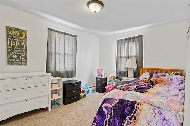 carpeted bedroom featuring baseboard heating