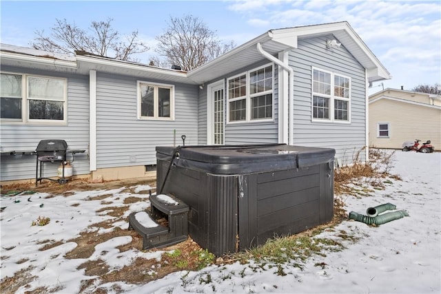 exterior space with a hot tub