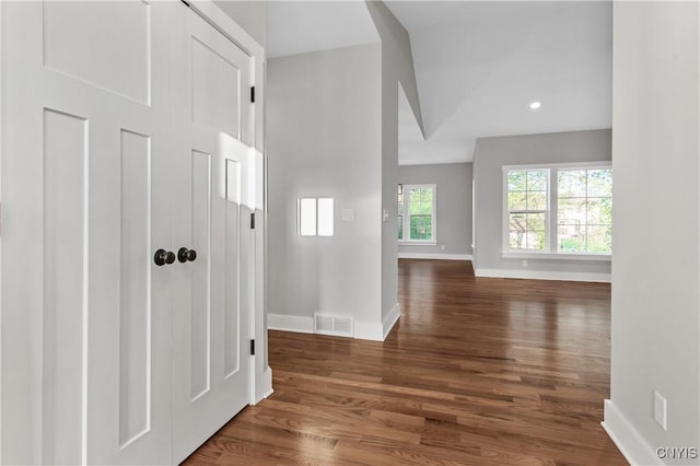 hall with dark hardwood / wood-style floors