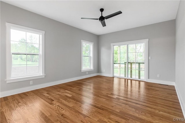 spare room with ceiling fan and hardwood / wood-style floors