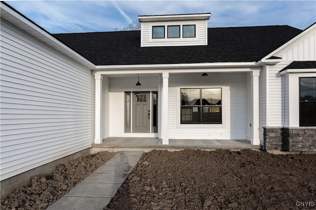 entrance to property featuring covered porch