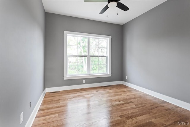 unfurnished room featuring light wood-type flooring and ceiling fan