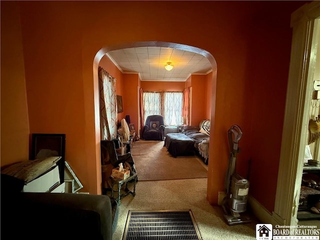 interior space with carpet floors and ornamental molding