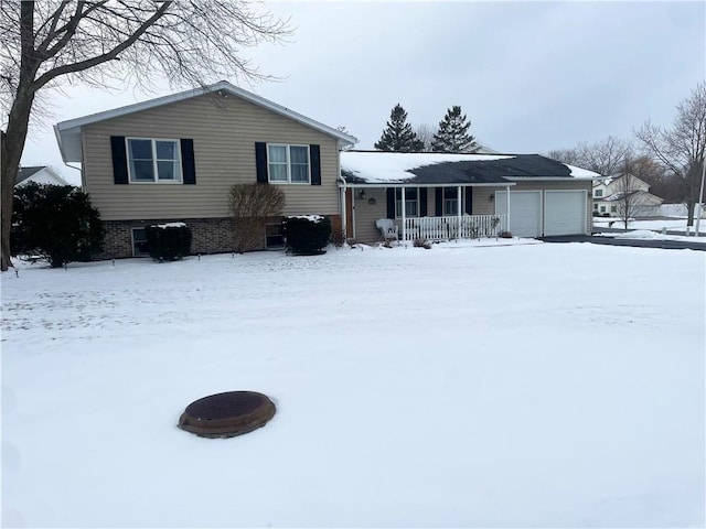 view of front of property with a garage and covered porch