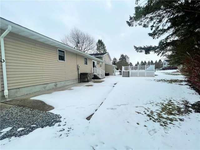 view of yard layered in snow