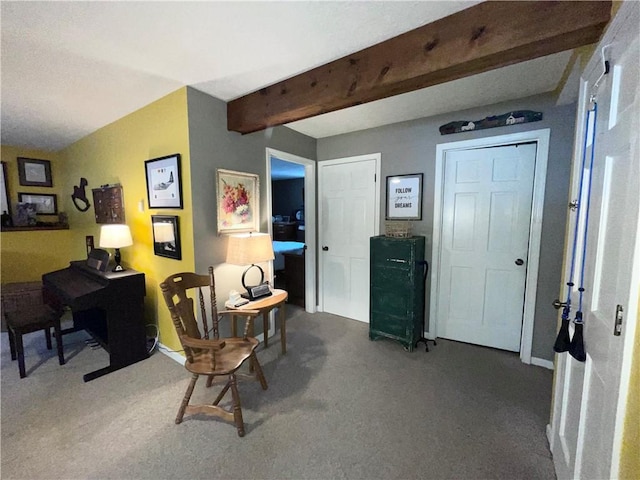 home office featuring carpet floors and beam ceiling