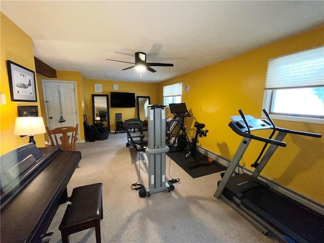 workout area with ceiling fan and a healthy amount of sunlight