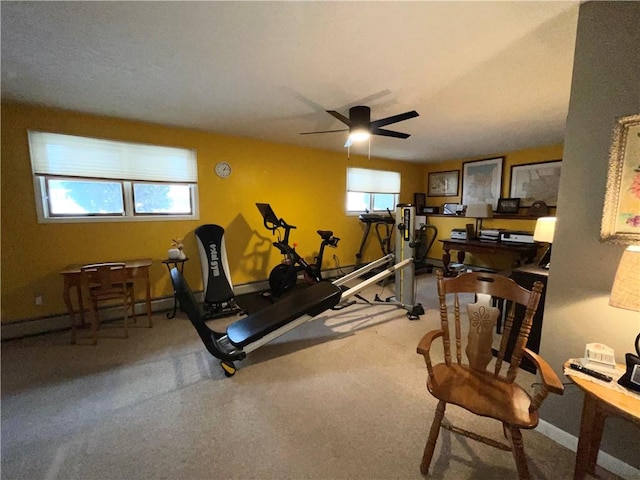 exercise room with ceiling fan and a healthy amount of sunlight