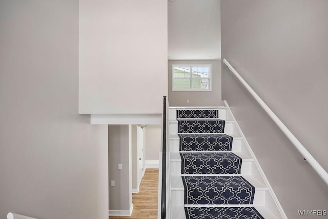 stairs with wood-type flooring