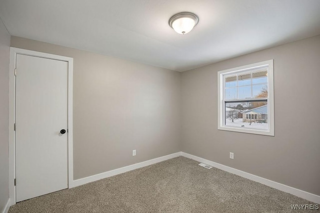 unfurnished room with carpet flooring