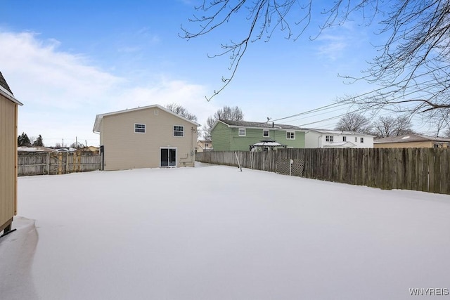 view of yard layered in snow