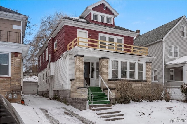 view of front of home with a balcony