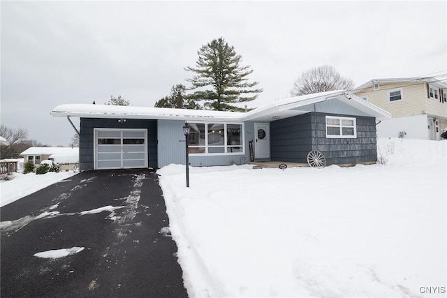 single story home featuring a garage