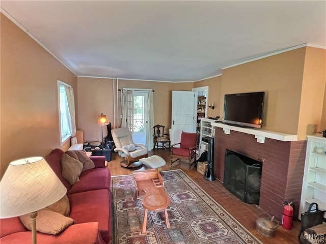 living room featuring wood-type flooring, a brick fireplace, and ornamental molding