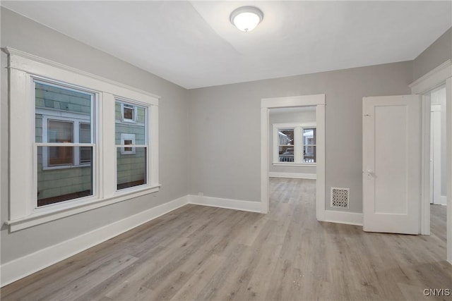 spare room with light hardwood / wood-style floors