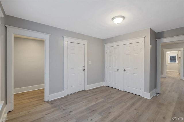 unfurnished bedroom featuring light hardwood / wood-style flooring