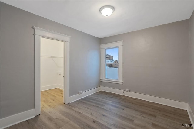 empty room with light hardwood / wood-style floors