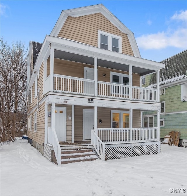 view of front of house featuring a porch and a balcony