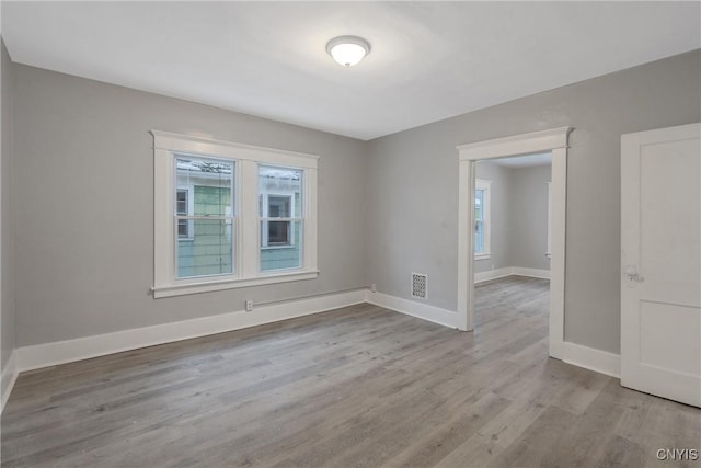 unfurnished room featuring light hardwood / wood-style flooring