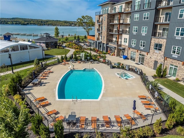 view of pool featuring a water view