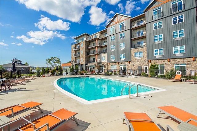 view of swimming pool featuring a patio