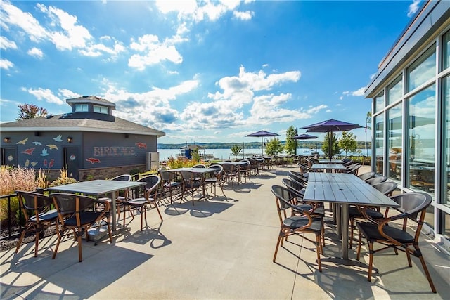 view of patio / terrace with a water view