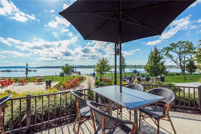 wooden deck featuring a water view