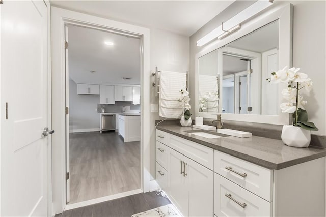 bathroom with vanity and hardwood / wood-style floors