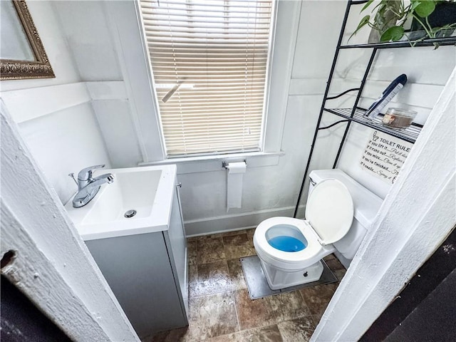 bathroom with vanity and toilet