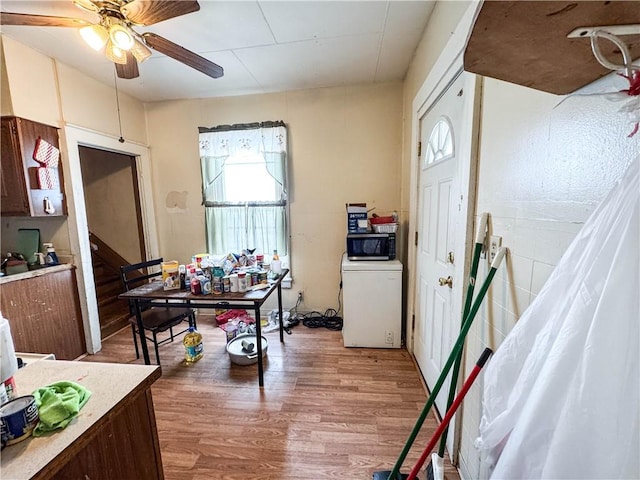 entryway with ceiling fan and hardwood / wood-style floors