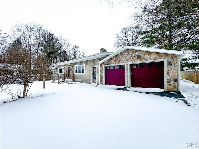 ranch-style house featuring a garage