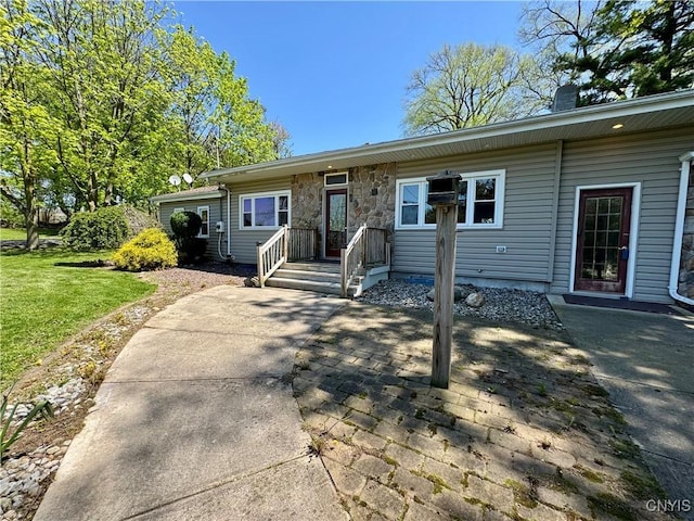 5902 N Rd, Owasco, NY 13021 - view of front facade with a patio, a chimney, and a front lawn