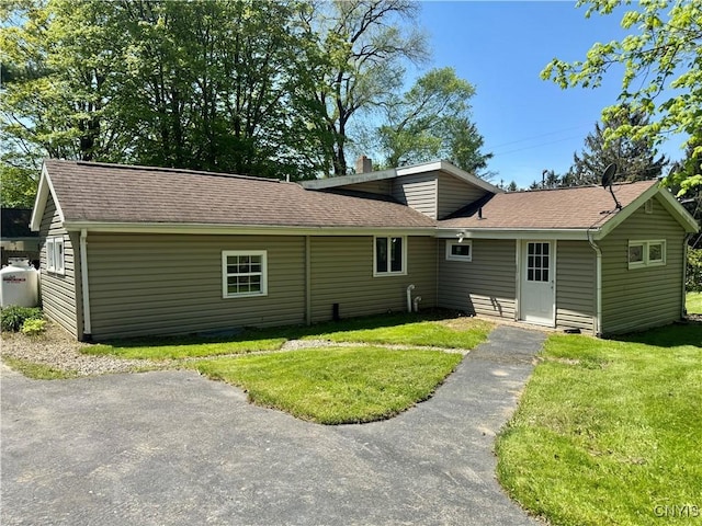 5902 N Rd, Owasco, NY 13021 - back of property featuring a yard and roof with shingles