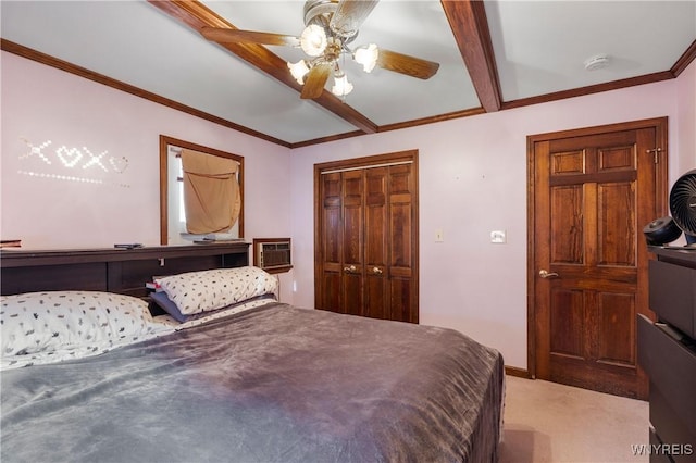 carpeted bedroom with ornamental molding, a wall mounted AC, ceiling fan, and a closet