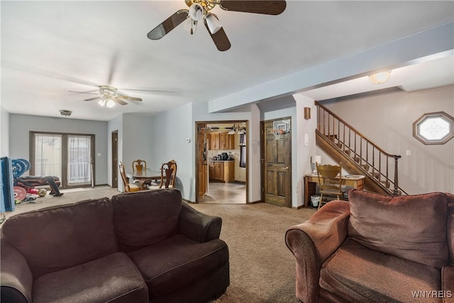 carpeted living room featuring ceiling fan