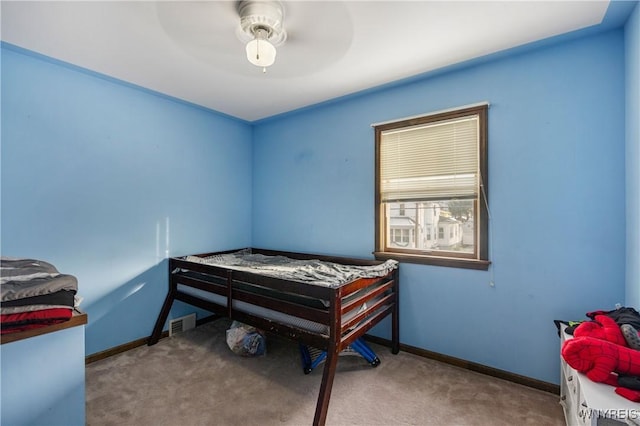 bedroom with ceiling fan and carpet