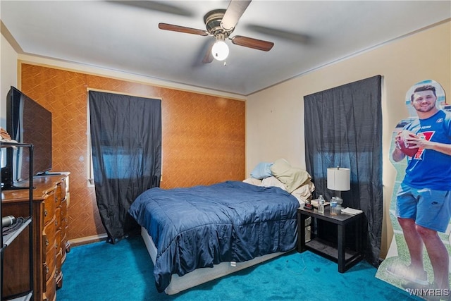 bedroom featuring ornamental molding, ceiling fan, and carpet flooring