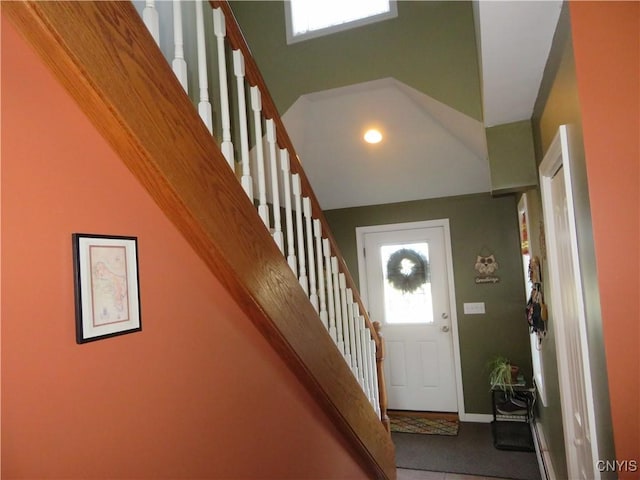 foyer entrance featuring a high ceiling and tile patterned flooring