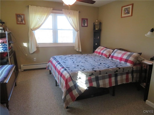 carpeted bedroom with baseboard heating and ceiling fan