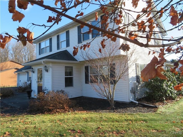 view of property exterior featuring a lawn