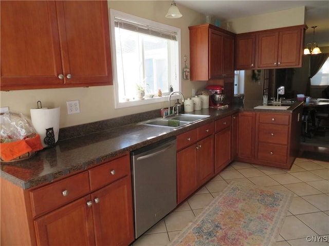 kitchen with stainless steel dishwasher, decorative light fixtures, sink, and light tile patterned floors